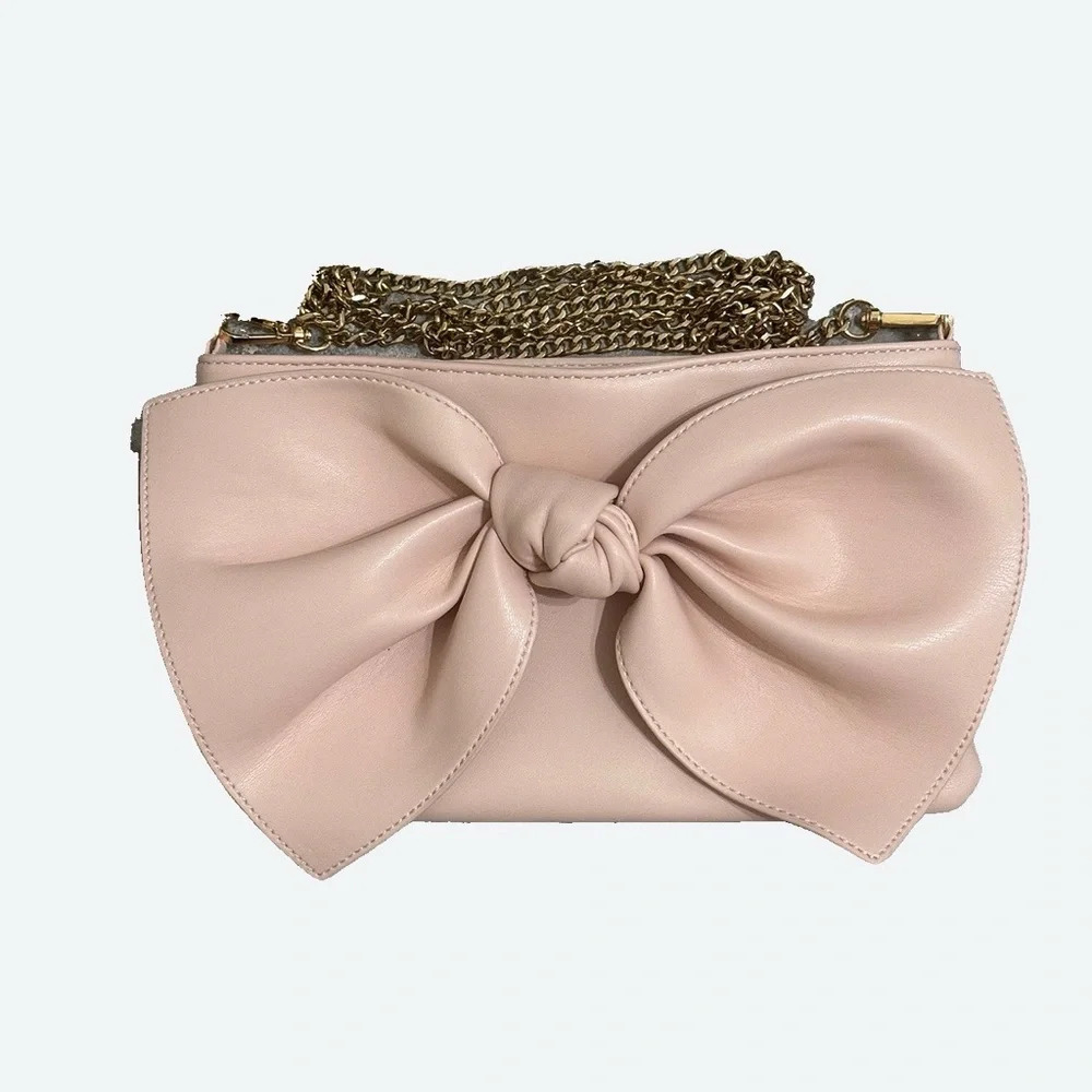 Pink bow bag with gold hardware